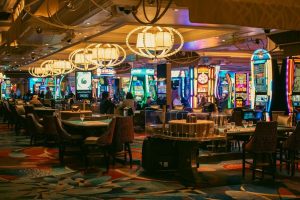 A casino interior with slots and tables is shown.